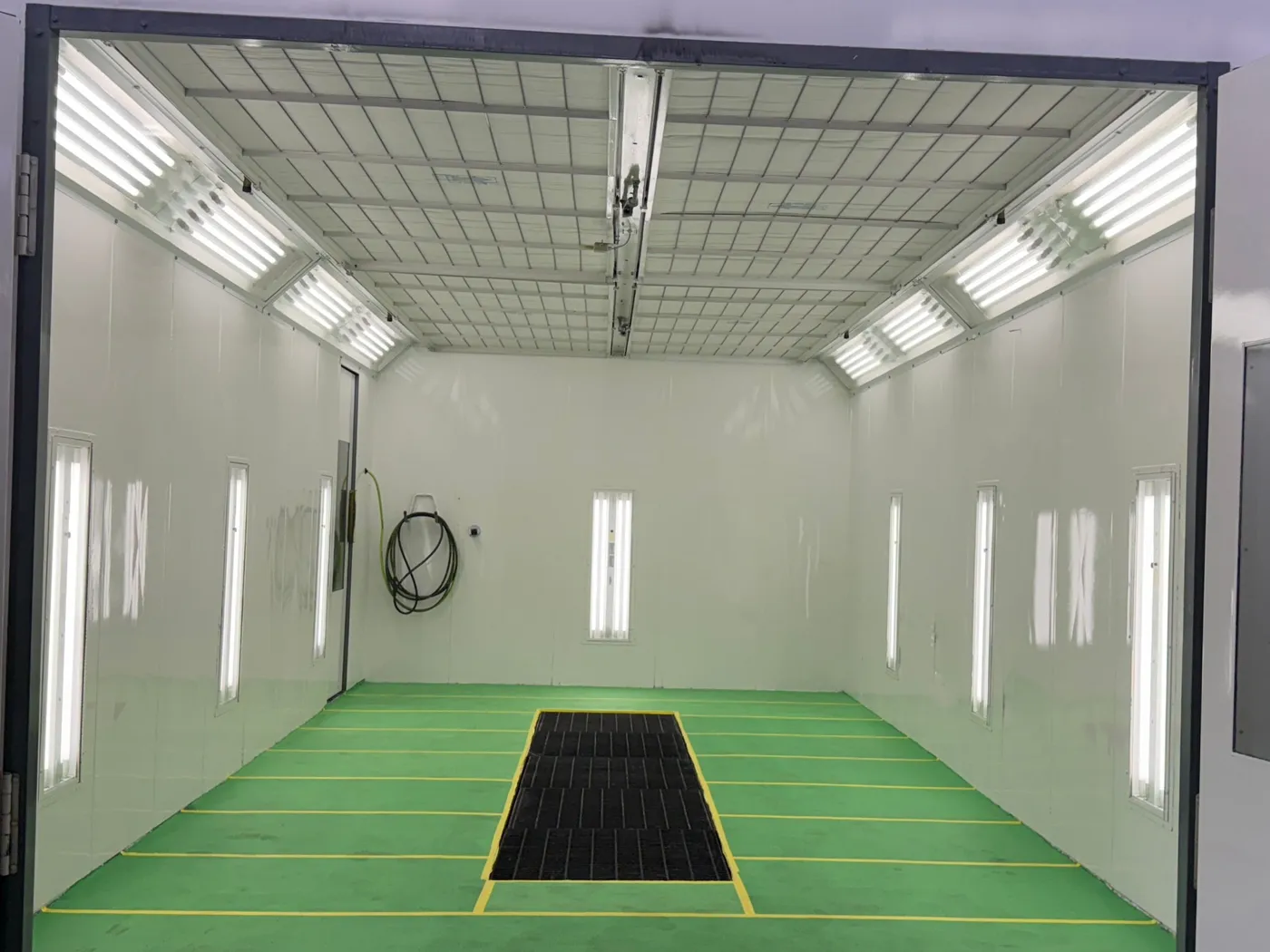 Paint booth interior at C-Auto Inc.