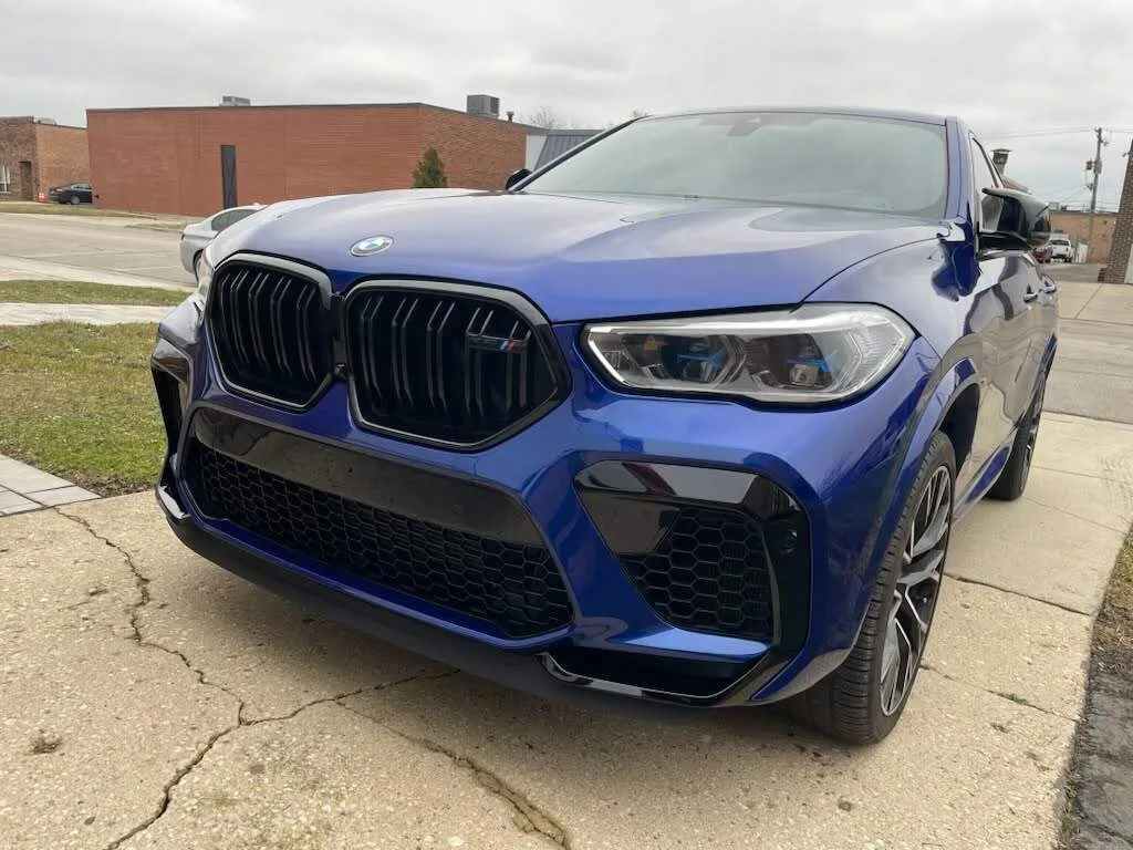 BMW X6 M completed — front end fully restored after collision repair