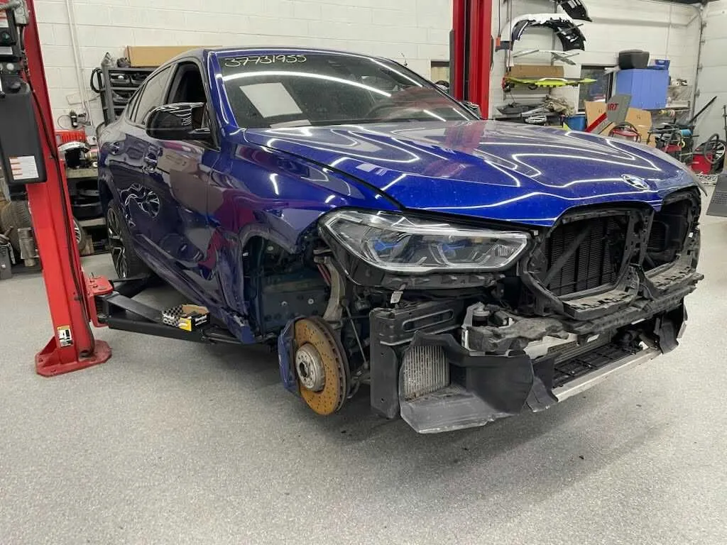 BMW X6 M front end disassembled during structural repair